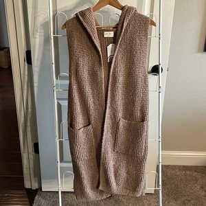Long sweater vest with hood and pockets